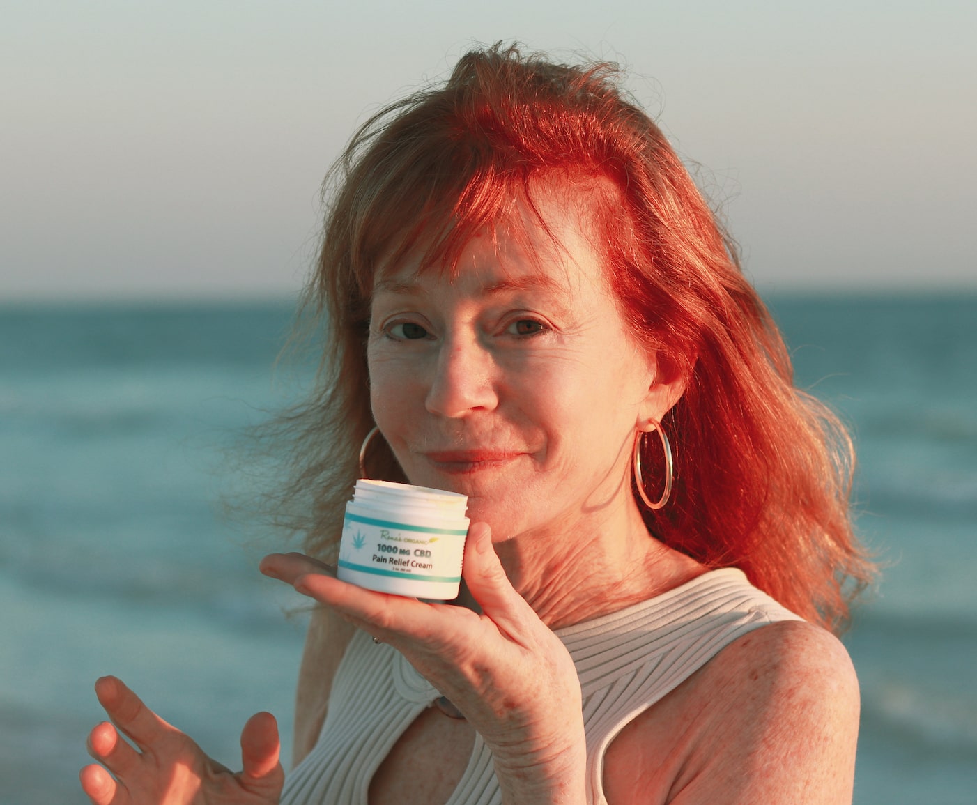 Rena holding 1000 mg CBD pain relief cream